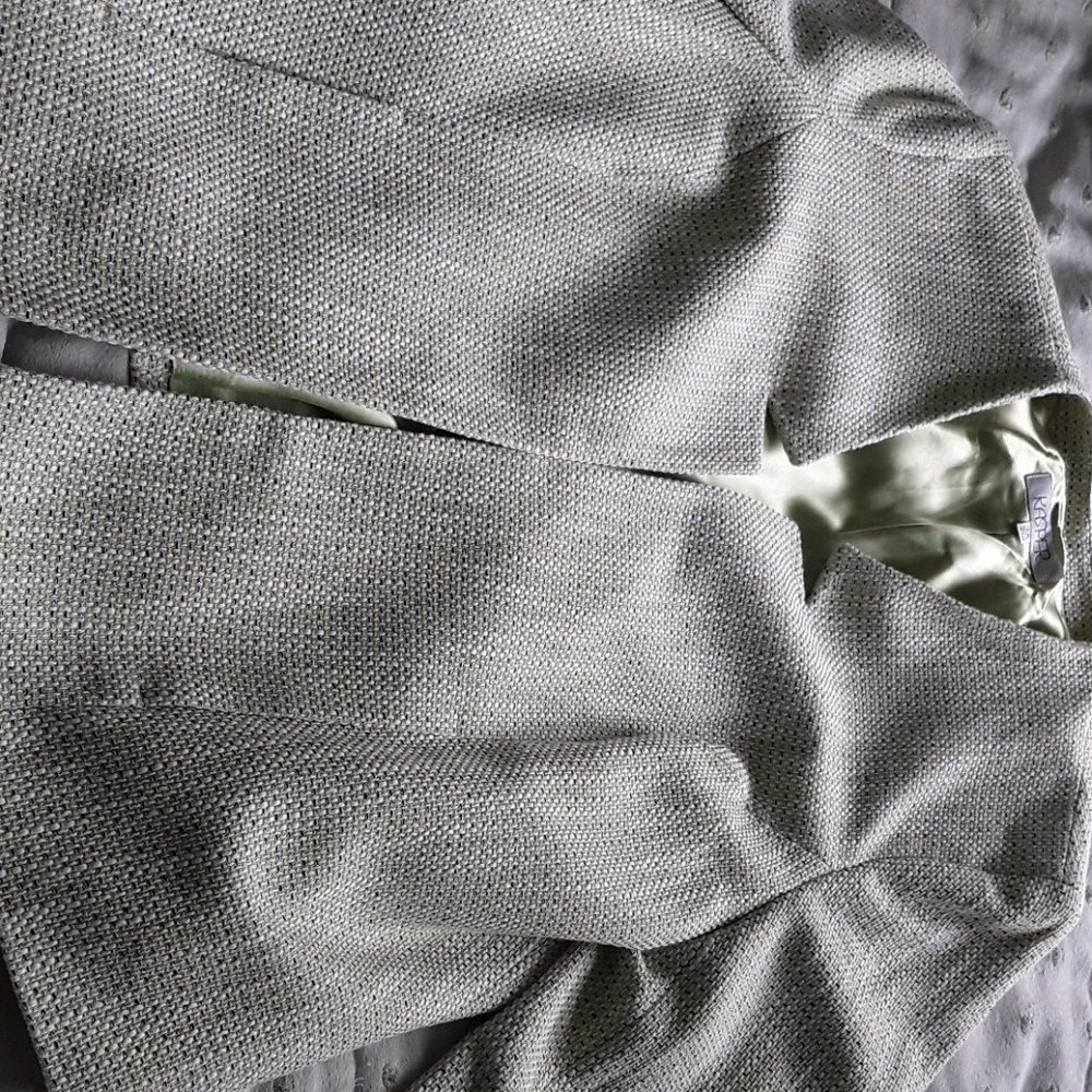 Long sleeved jacket with bright green lining